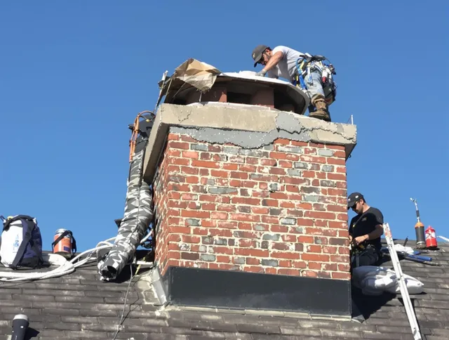 Brea Chimney Sweep installing a custom chimney crown in Brea, CA