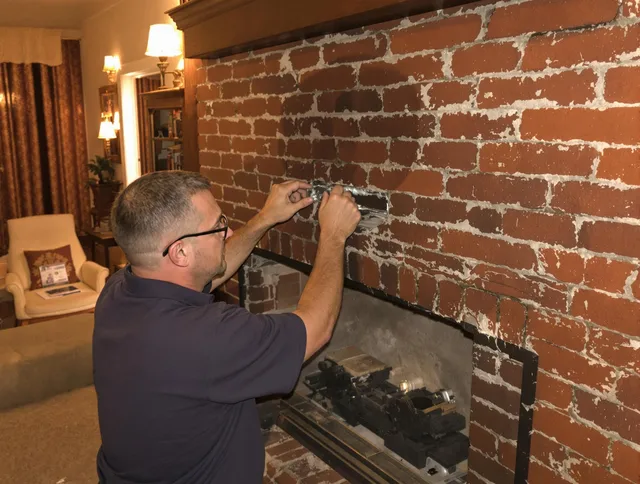 Brea Chimney Sweep expert fixing a fireplace in Brea, CA